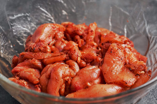 seasoned chicken thighs mixed with paprika and spices