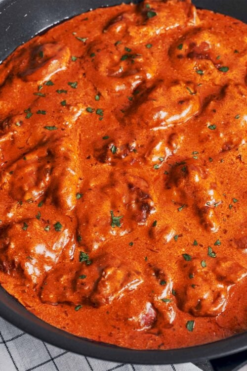 creamy paprika chicken in a velvety paprika sauce finished with fresh parsley