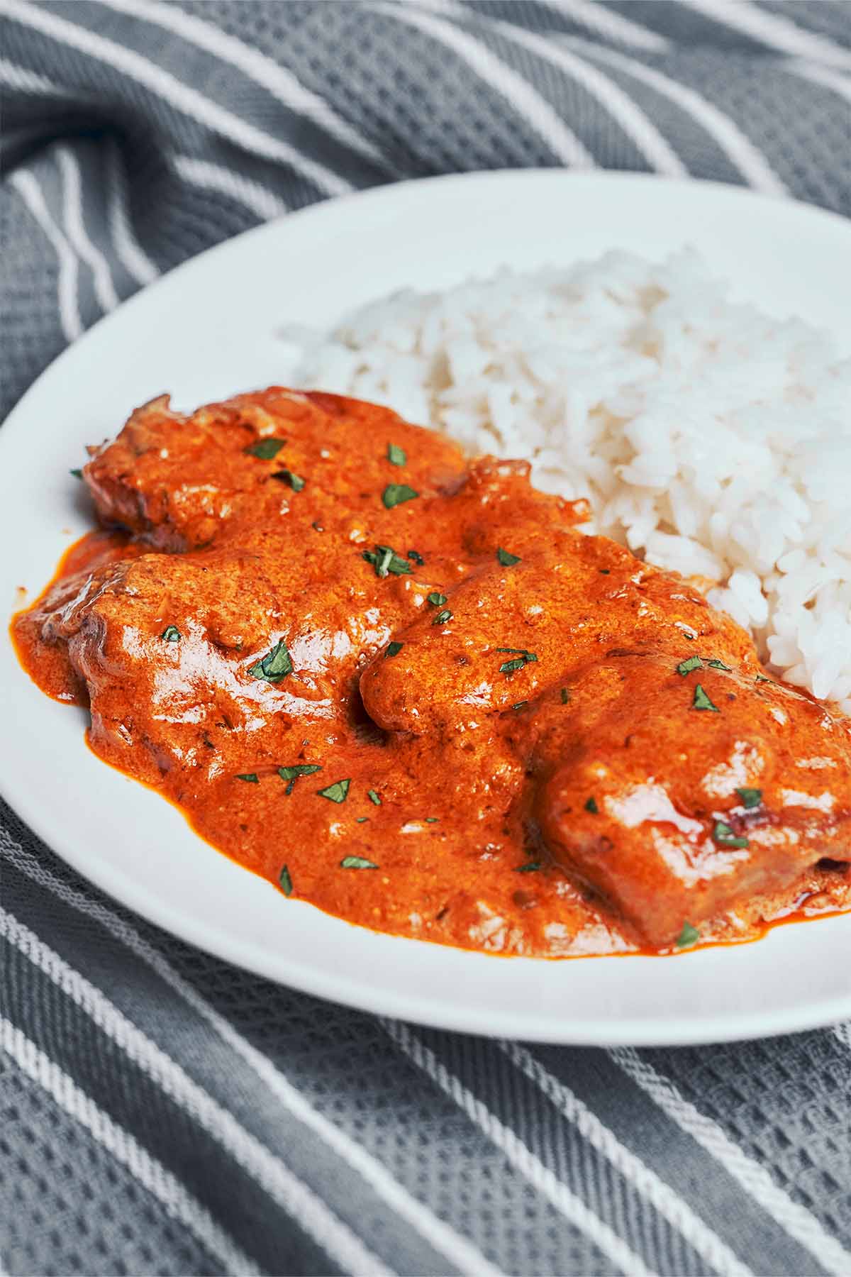 tender chicken in a creamy paprika sauce served with fluffy rice