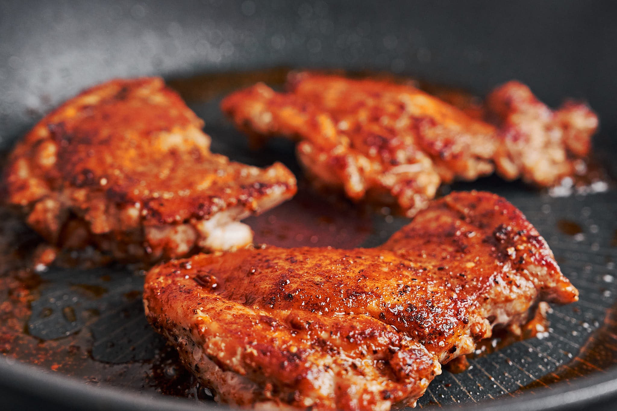 chicken thighs getting a beautiful golden crust before adding the Dijon cream sauce
