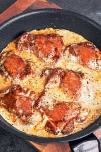 skillet creamy Dijon chicken thighs in a rich creamy sauce