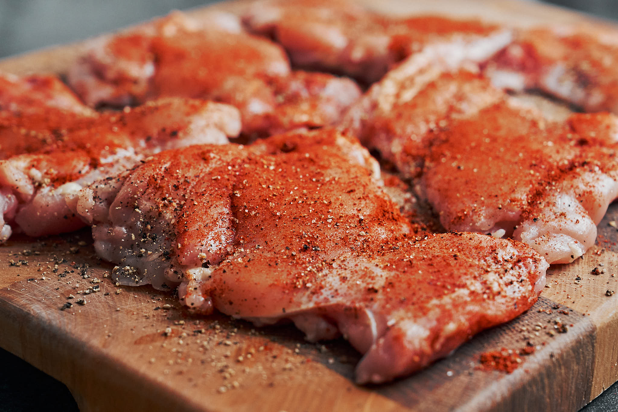 chicken thighs seasoned with spices before cooking creamy dijon chicken
