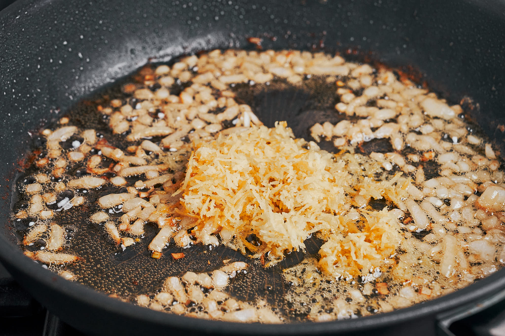fresh lemon zest sizzling in butter and onions to build the lemon cream sauce