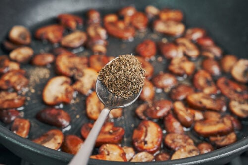 dried thyme sprinkled over browned mushrooms