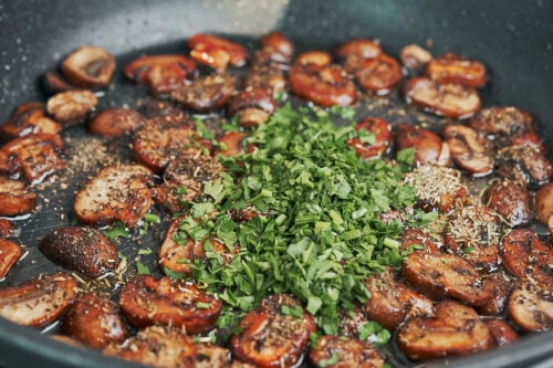 fresh chopped parsley added to sautéed mushrooms