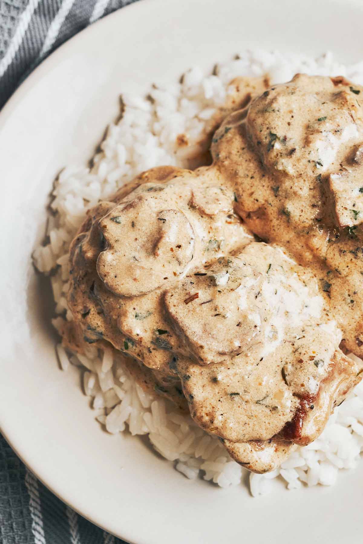cozy creamy mushroom chicken spooned generously over fluffy rice