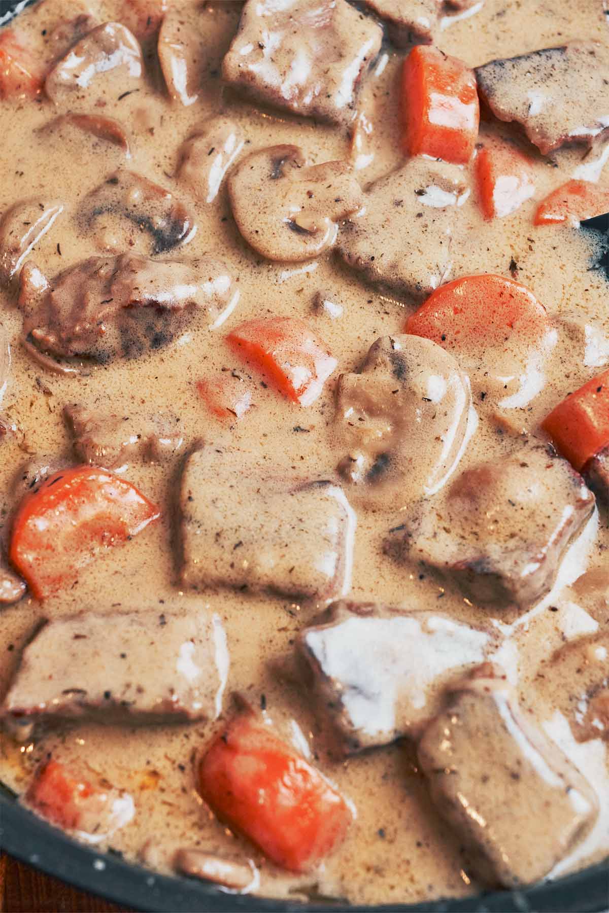 a close look at this creamy beef stew with tender beef and vegetables