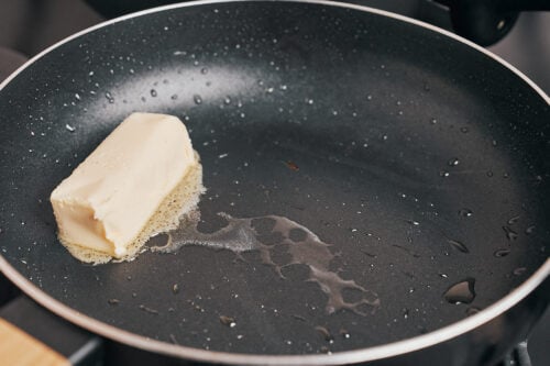 starting the sauce by melting butter in the pan