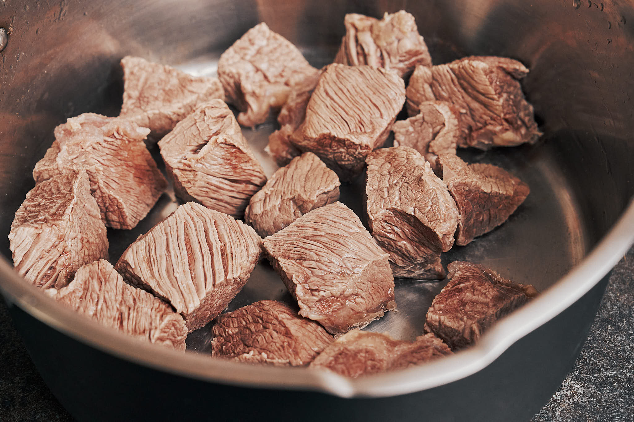 beef pieces just after blanching before they go into the pan for browning