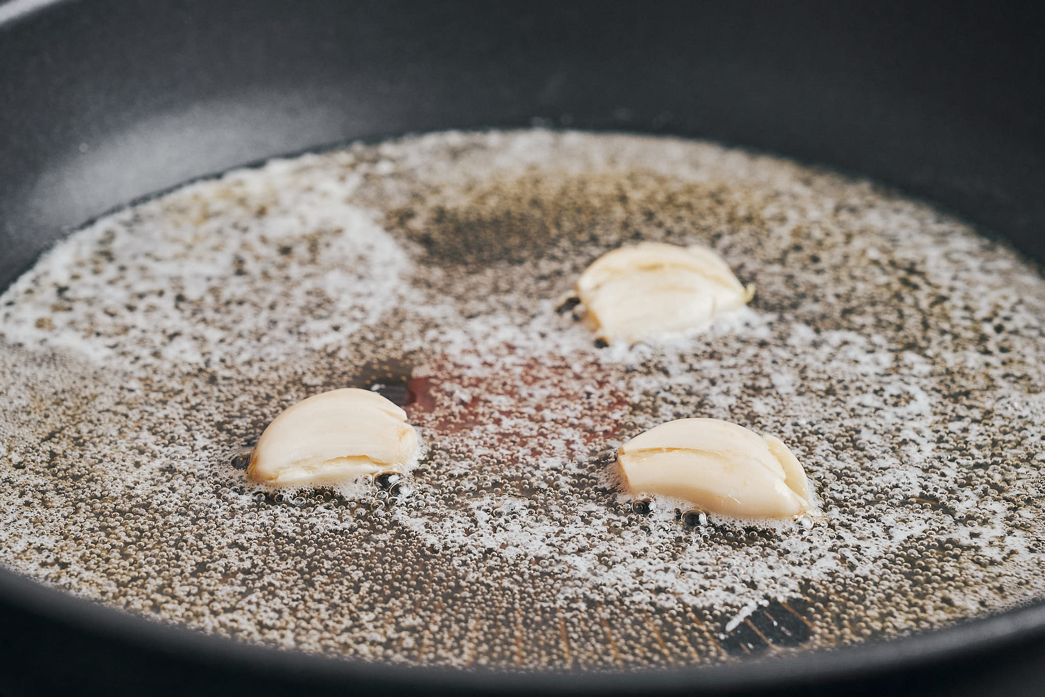 garlic gently cooking in butter to start building the stew flavor
