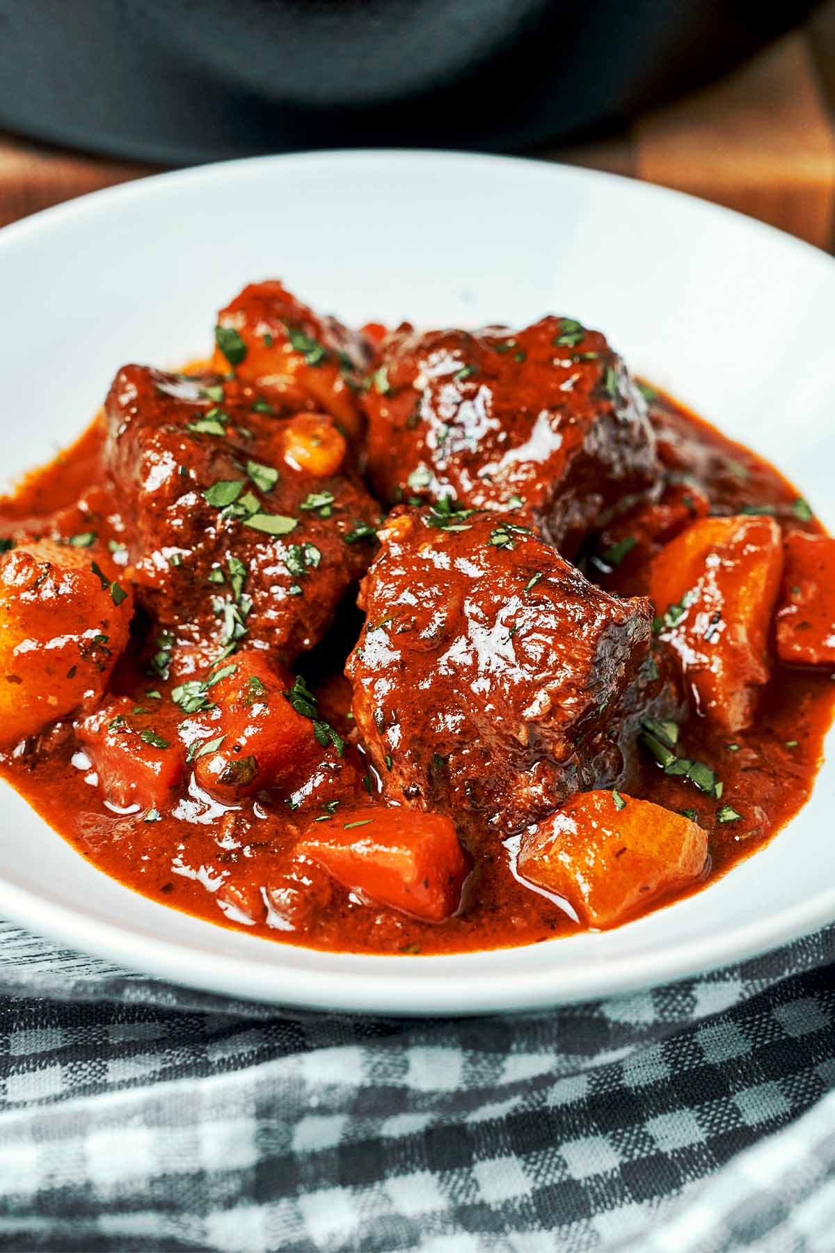 Classic beef stew served in a bowl with tender beef, potatoes, carrots, and rich glossy gravy.