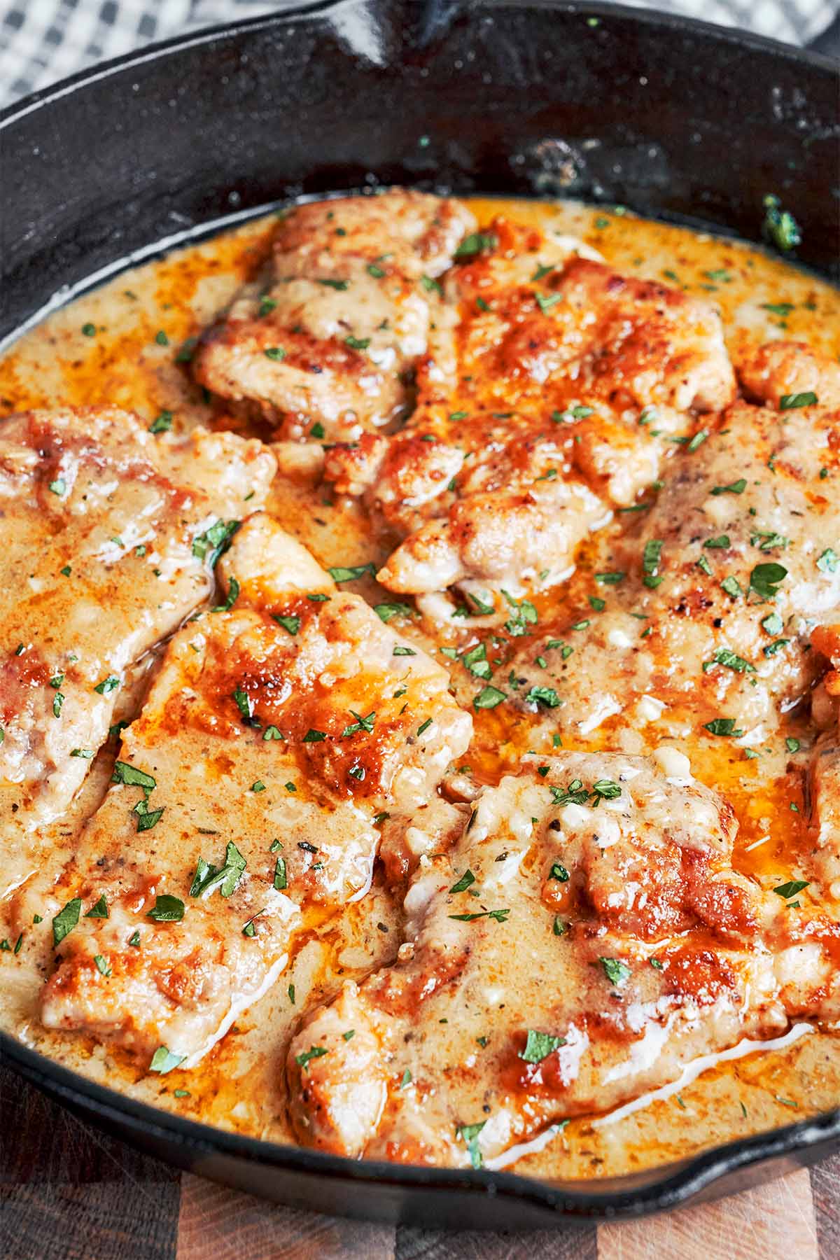 Creamy chicken without cream finished in the skillet with garlic Parmesan sauce.