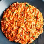Creamy ground beef orzo served in a bowl with rich tomato-cream sauce, Parmesan, and fresh parsley.