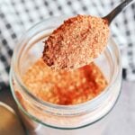Simple pantry spices for homemade Cajun seasoning arranged on a plate.