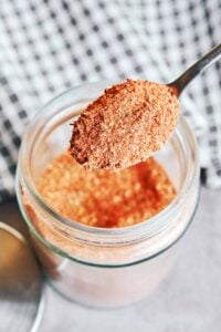 Simple pantry spices for homemade Cajun seasoning arranged on a plate.