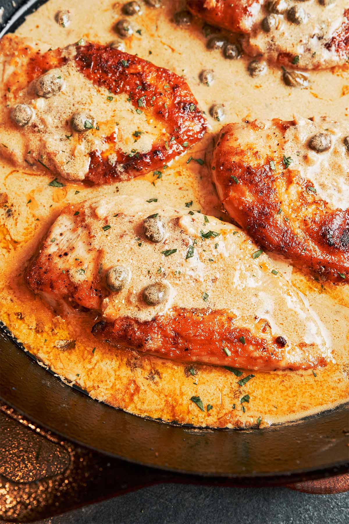 Creamy chicken piccata with golden pan-seared chicken in a silky lemon caper cream sauce with capers and fresh parsley.