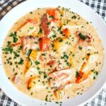 Homemade creamy chicken soup with tender chicken, vegetables, and a silky cream broth.