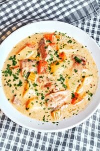 Homemade creamy chicken soup with tender chicken, vegetables, and a silky cream broth.