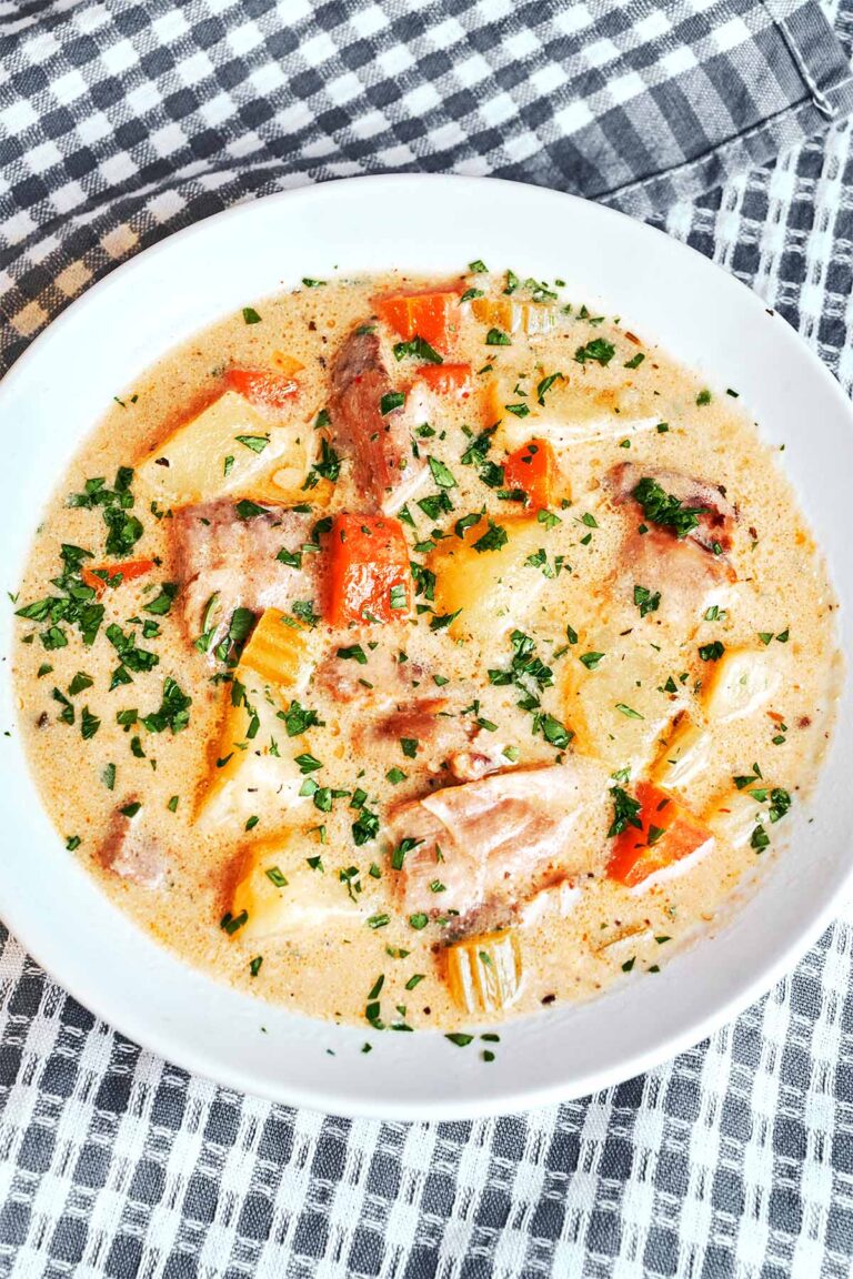 Homemade creamy chicken soup with tender chicken, vegetables, and a silky cream broth.