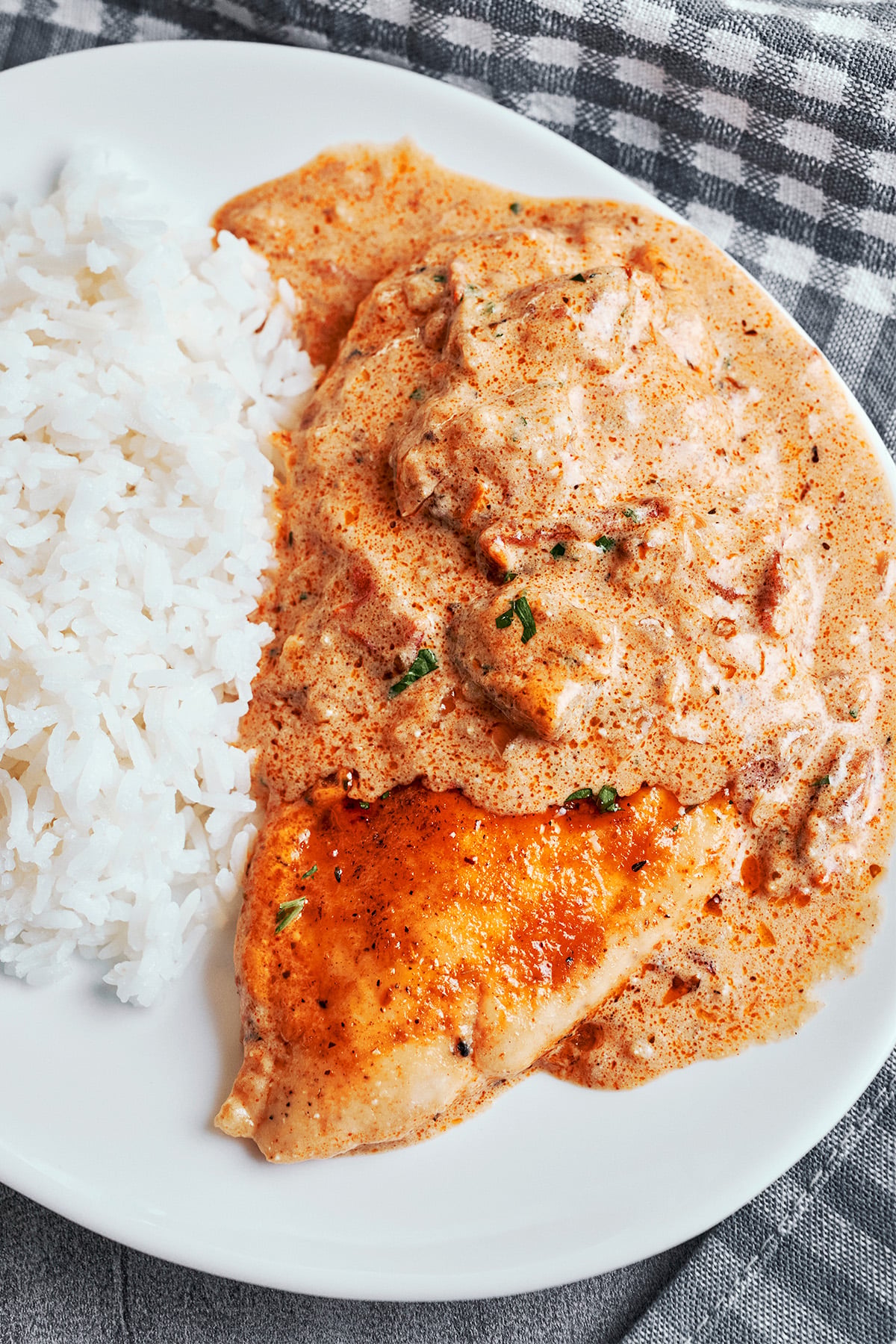Creamy Cajun chicken served with white rice and Cajun cream sauce