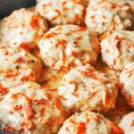 Homemade chicken meatballs simmered in a cozy white sauce with carrot and onion