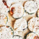 Creamy zucchini with golden-browned rounds tucked into a rich, cozy garlic herb sauce.