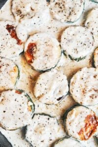 Creamy zucchini with golden-browned rounds tucked into a rich, cozy garlic herb sauce.