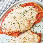 Crispy Chicken Parmesan with golden breaded chicken, rich tomato sauce, melted mozzarella, and fresh parsley.