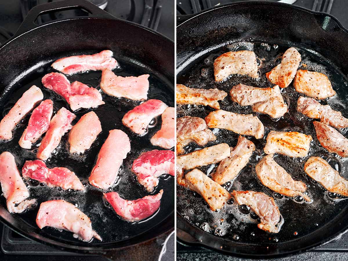Pork pieces searing in a hot cast-iron skillet until lightly browned around the edges.