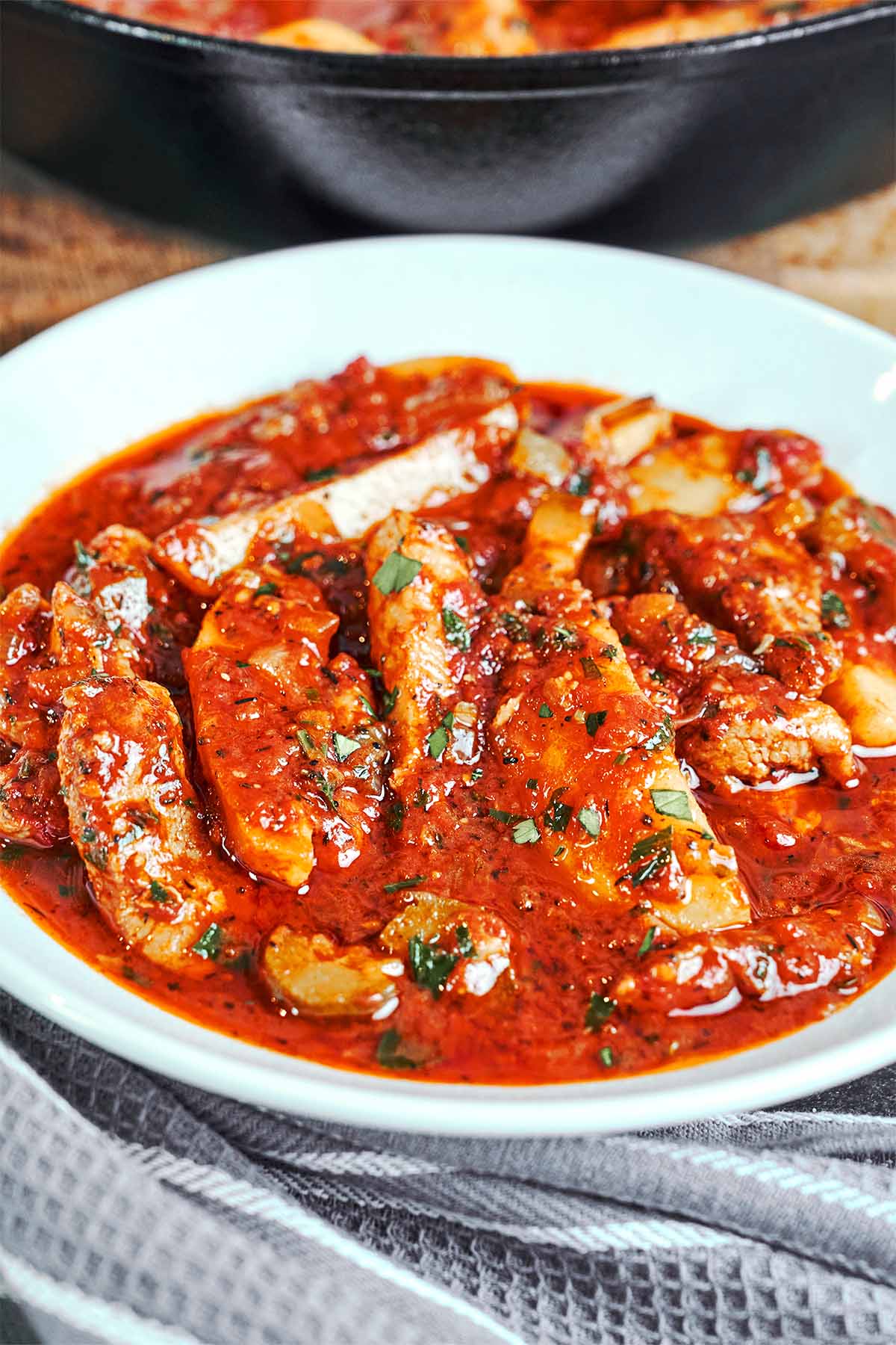 Tender pork and golden potato wedges served in a rich tomato-pickle sauce and finished with fresh parsley.