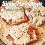 Creamy Dijon Pork Chops in a cast-iron skillet covered with silky mustard cream sauce and finished with parsley