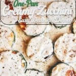 Golden-browned creamy zucchini rounds coated in a rich garlic herb sauce in a skillet.