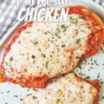 Vertical recipe pin showing crispy Chicken Parmesan topped with tomato sauce, melted mozzarella, and parsley.