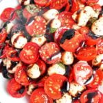 Caprese Salad with juicy cherry tomatoes, fresh mozzarella, basil, and a glossy balsamic glaze