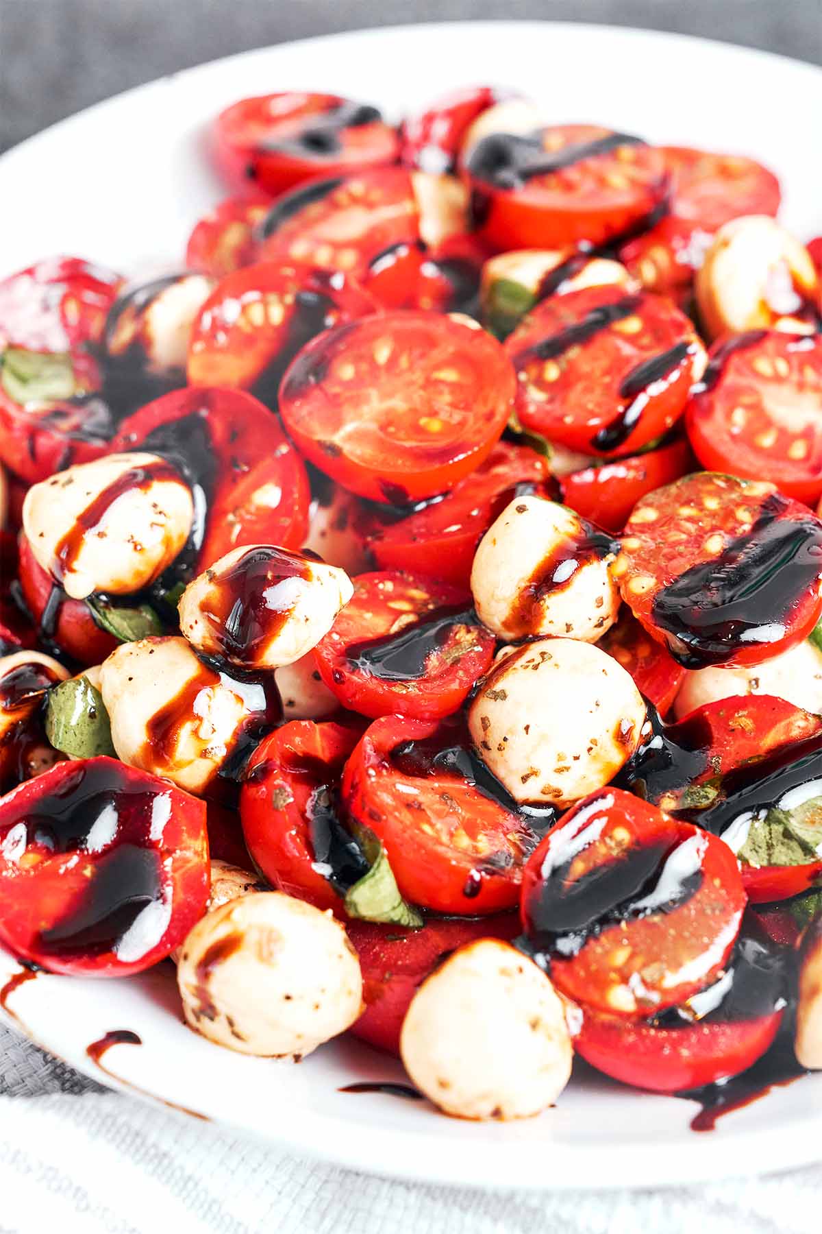 Juicy cherry tomatoes and fresh mozzarella finished with a glossy balsamic glaze