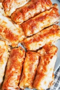 Crispy cheesy baked zucchini wedges with golden edges and melted mozzarella, ready to serve warm.