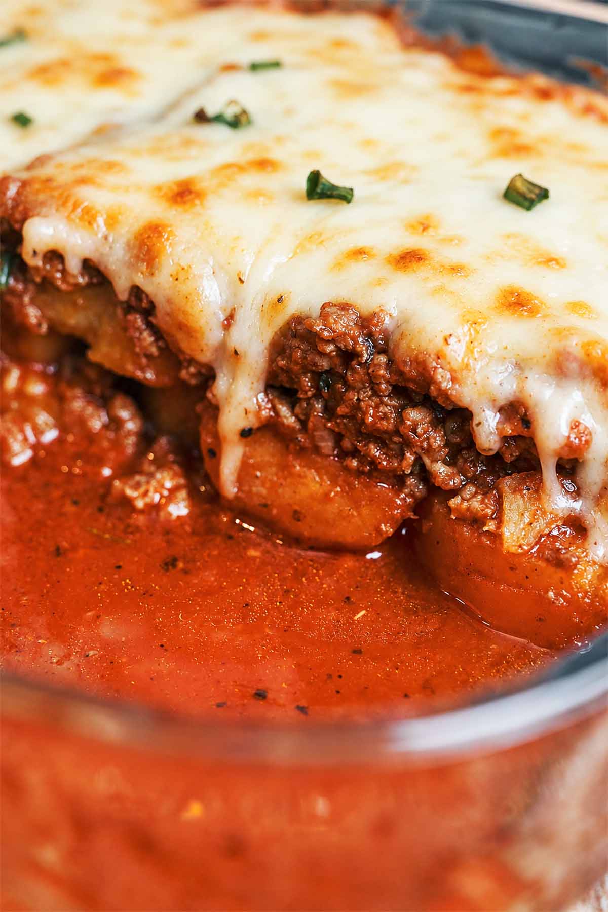 Ground Beef and Potato Tomato Casserole with tender potatoes, rich tomato beef, and a golden layer of melted mozzarella.