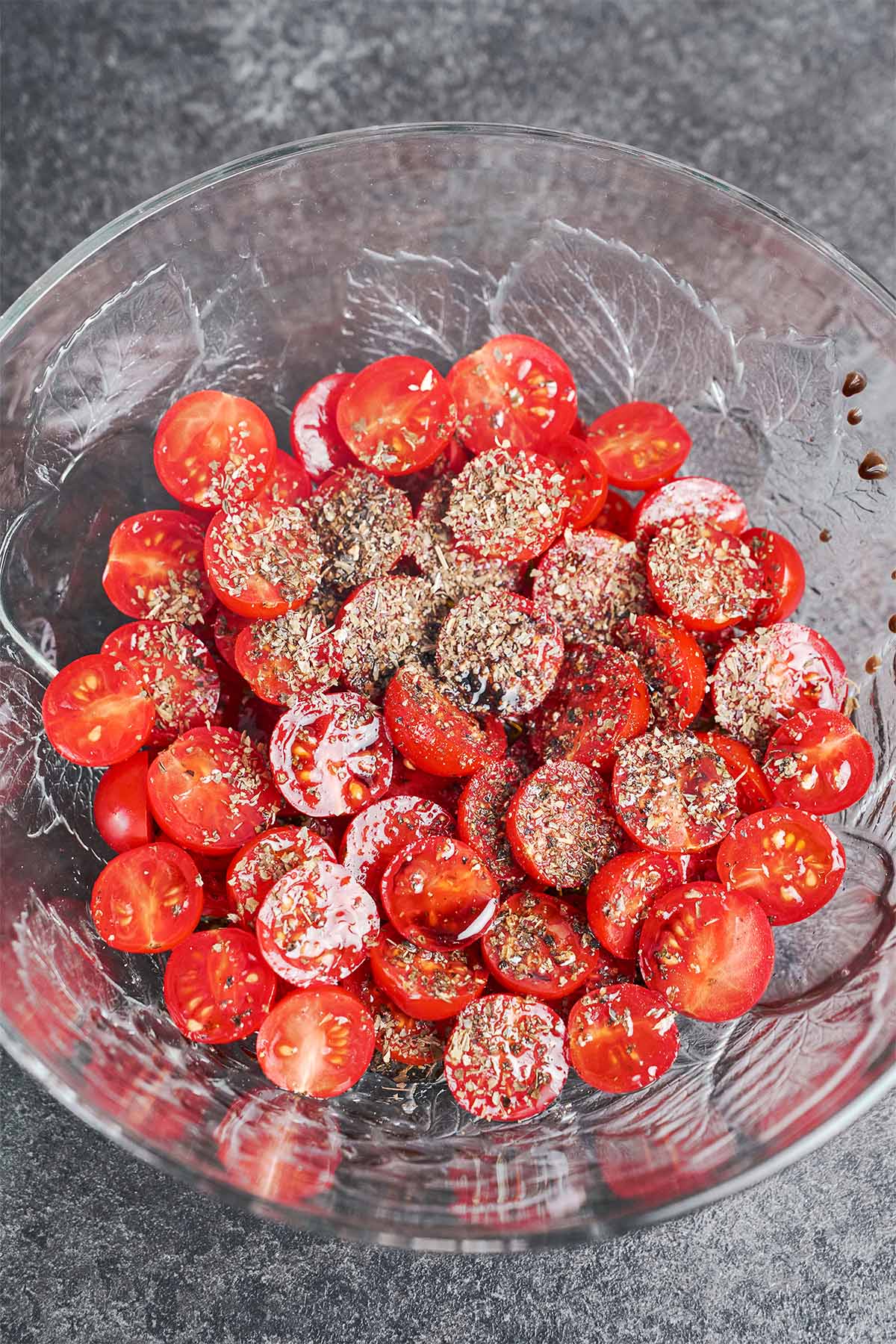 Cherry tomatoes tossed with olive oil, balsamic vinegar, black pepper, and dried basil