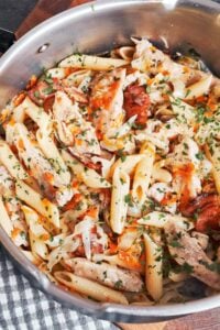Pork and cabbage pasta with tender pork shoulder, smoky bacon, penne, and fresh parsley