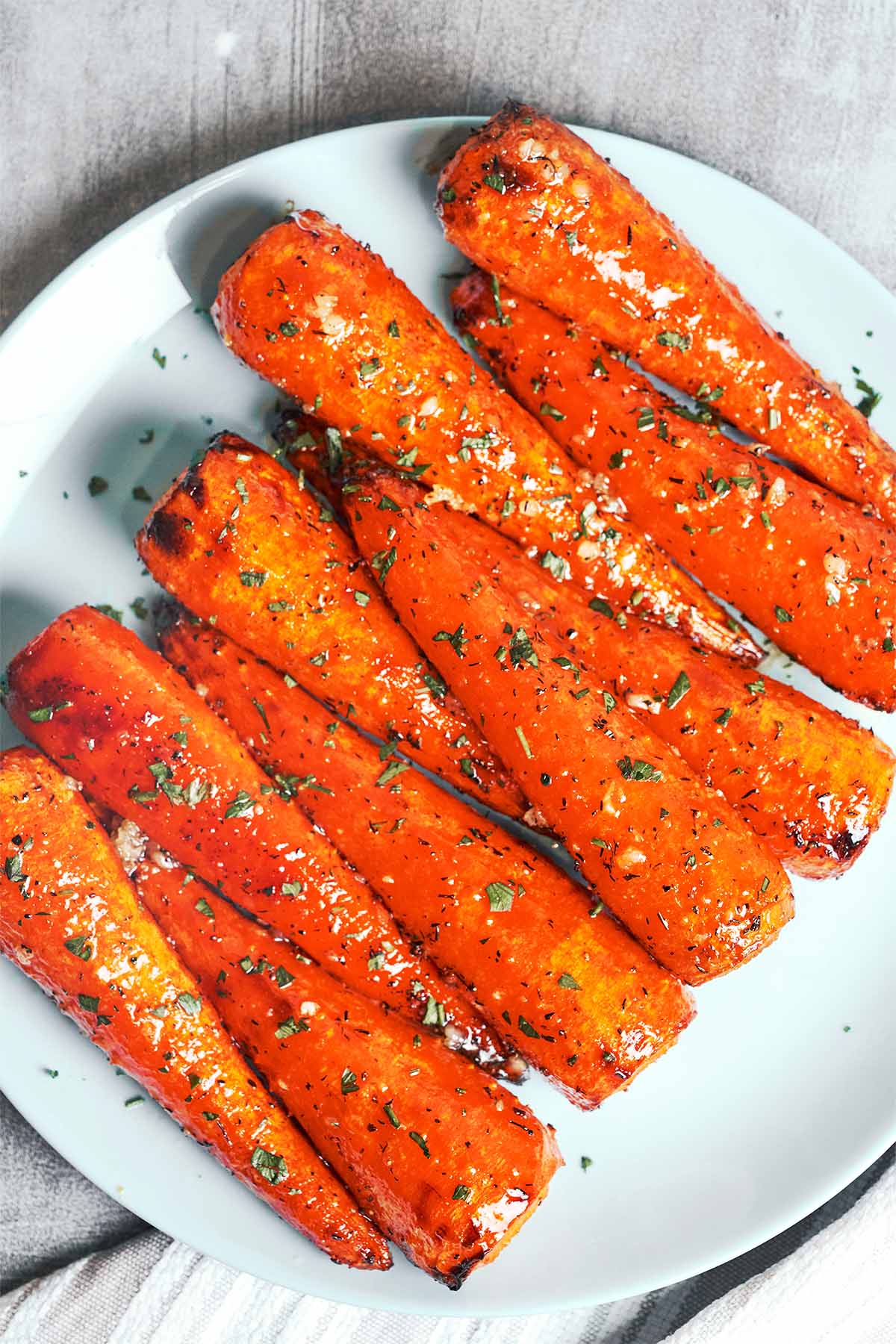 Caramelized honey garlic butter roasted carrots finished with herbs and a glossy sweet-savory glaze