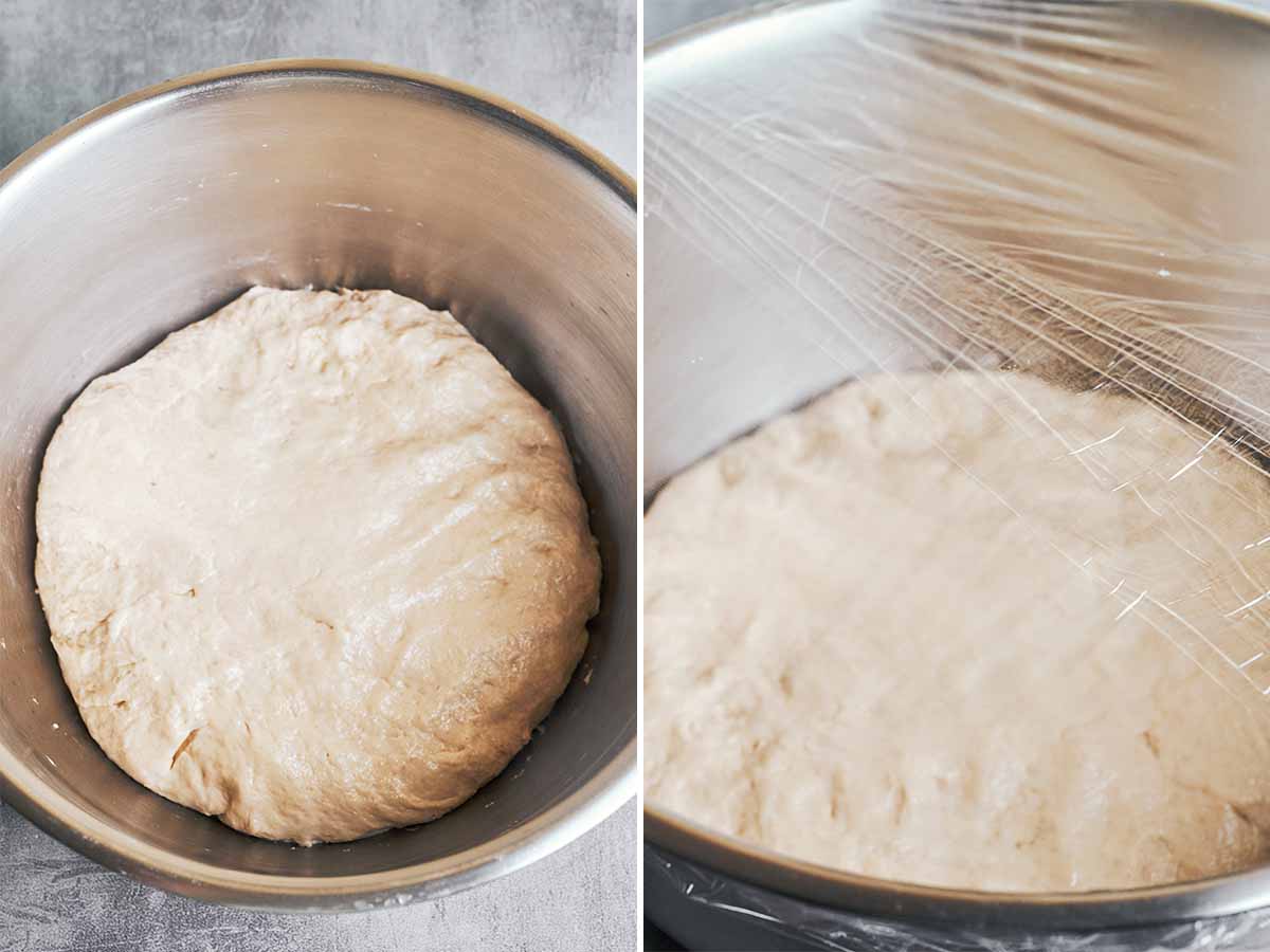 Soft bread dough resting in a covered bowl during the first rise