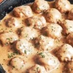 Swedish meatballs coated in rich creamy gravy with fresh parsley