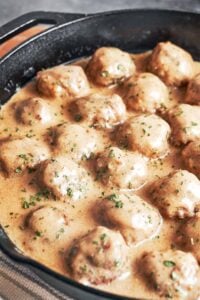Swedish meatballs coated in rich creamy gravy with fresh parsley