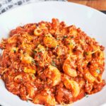 American goulash with ground beef and elbow macaroni in a rich tomato sauce, finished with melted cheddar and parsley.